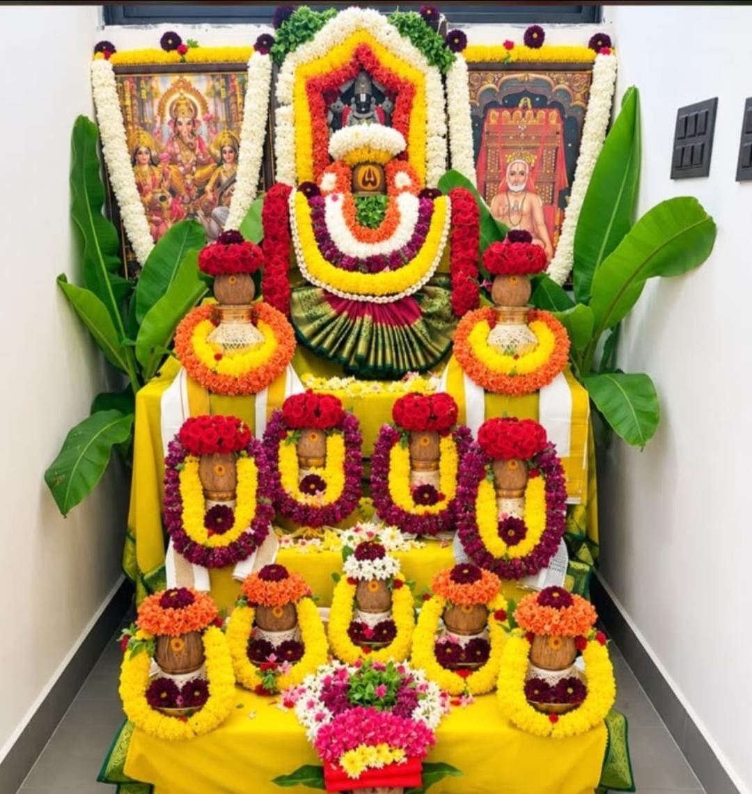 Traditional multi-tier Kalasha Alankara with fresh marigold floral decoration